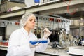 Focused female technician working in research laboratory Royalty Free Stock Photo