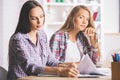 Focused females working on project Royalty Free Stock Photo