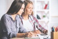 Focused females working on project Royalty Free Stock Photo