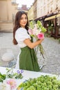 Florist Arranging Fresh Flowers at Outdoor Market. Florist at work. Workplace. Small business Royalty Free Stock Photo