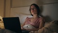 Focused freelancer working bed searching idea closeup. Late girl typing laptop Royalty Free Stock Photo