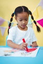 Focused girl colouring her book Royalty Free Stock Photo