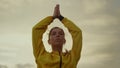 Focused girl doing yoga tree pose. Attractive woman holding hands above head Royalty Free Stock Photo