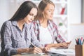 Focused girls working on project Royalty Free Stock Photo