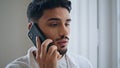 Focused guy call cellphone at flat portrait. Serious man speaking telephone Royalty Free Stock Photo