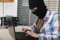 Focused hacker working on a computer, stealing data Royalty Free Stock Photo