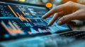 Focused Hand Interacting with Data Analytics Graphs on Laptop Displaying Complex Financial Insights Royalty Free Stock Photo