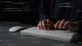 Focused Hands Typing on White Keyboard Surrounded by Code Snippets in Dark Room, Concept of Programming, Software Royalty Free Stock Photo