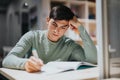 Focused high school student studying diligently in classroom setting