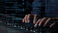 Close-up of Hands Typing on Keyboard Surrounded by Code and Digital Data Elements in a Tech Environment xenic Royalty Free Stock Photo