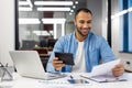 Indian businessman working in office with laptop and documents Royalty Free Stock Photo