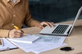 Focused indian businessman working at his office desk with laptop and documents Royalty Free Stock Photo