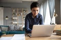 Focused indian businesswoman finishes project on laptop in hurry Royalty Free Stock Photo