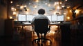 Focused individual working at a desk with multiple computer screens
