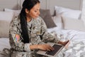 Focused inspired woman typing an email