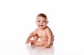 One year old baby girl sitting on white background. Royalty Free Stock Photo