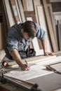 Focused joiner working in carpentry Royalty Free Stock Photo