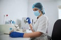 Focused lab technician preparing clinical specimens for a coagulation analysis Royalty Free Stock Photo