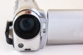 Focused on lens of mini video recorder put on white background