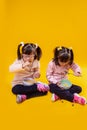 Focused little girls with mental disorder eating cereals with milk