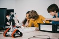 focused little kids constructing diy robots, stem Royalty Free Stock Photo