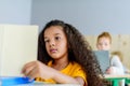 focused little schoolgirl reading book Royalty Free Stock Photo