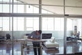 Focused male interior designer drawing on workbench