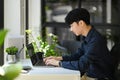 Focused male programmer or coder working for development website design in startup company Royalty Free Stock Photo