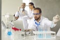 Focused male scientist in protective goggles doing medical research in laboratory Royalty Free Stock Photo