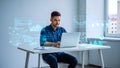 Young man working on laptop with futuristic holographic data visualizations and charts Royalty Free Stock Photo