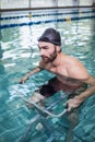 Focused man doing underwater bike Royalty Free Stock Photo