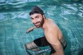 Focused man doing underwater bike Royalty Free Stock Photo