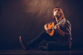 Focused man with guitar.