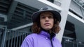 Focused man looking camera outdoor. Stylish hipster posing on city street. Royalty Free Stock Photo