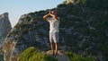 Focused man practicing yoga at beautiful ocean cliff morning. Yogi relax breathe