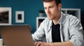 Focused man using laptop, home Royalty Free Stock Photo