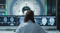 Focused medical professional interprets brain scans during MRI session, from behind