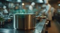 Focused medium shot of a sleek stockpot sensor sending realtime Brix level updates with outoffocus chefs and kitchen Royalty Free Stock Photo