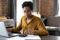 Focused millennial Black business woman calculating finance Royalty Free Stock Photo