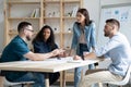 Focused mixed race business people company employees discussing project. Royalty Free Stock Photo