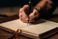 Focused note-taking, Close-up of man\'s hand writing in his notebook
