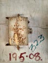 A focused old and dust electricity meter box.