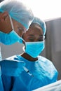 Focused on the operation. two surgeons operating on a patient in a hospital.