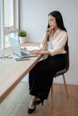 A focused and professional Asian businesswoman is working on her laptop computer in the office Royalty Free Stock Photo