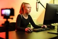 Professional e-sport gamer girl streaming and plays online video game on PC Royalty Free Stock Photo