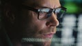 Focused programer face watching computer in data hologram closeup. Man coding Royalty Free Stock Photo