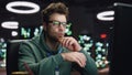 Focused scripter looking computer typing keyboard at night datacenter closeup Royalty Free Stock Photo