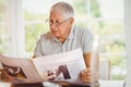 Focused senior man reading newspaper Royalty Free Stock Photo