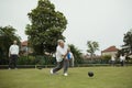 Focused Senior Woman Lawn Bowling