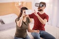 Focused serious couple estimating VR technology